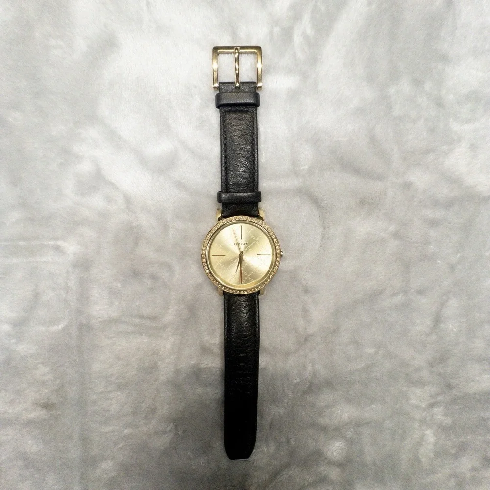 DKNY 111007 Gold Tone All Over Logo Womens 43mm Wristwatch Gem Set Bezel